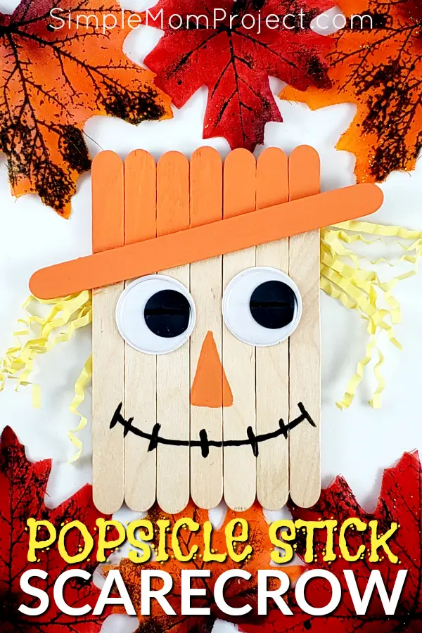 Looking for a fun, DiY Fall or fall party decoration for kids to make? Click now for a cheap, popsicle stick Scarecrow craft tutorial. Do them with your preschoolers in the classroom or at home with your toddlers. This Fall Scarecrow is budget friendly and SO easy to do! #PopsicleSticks #FallCrafts #AutumnCrafts