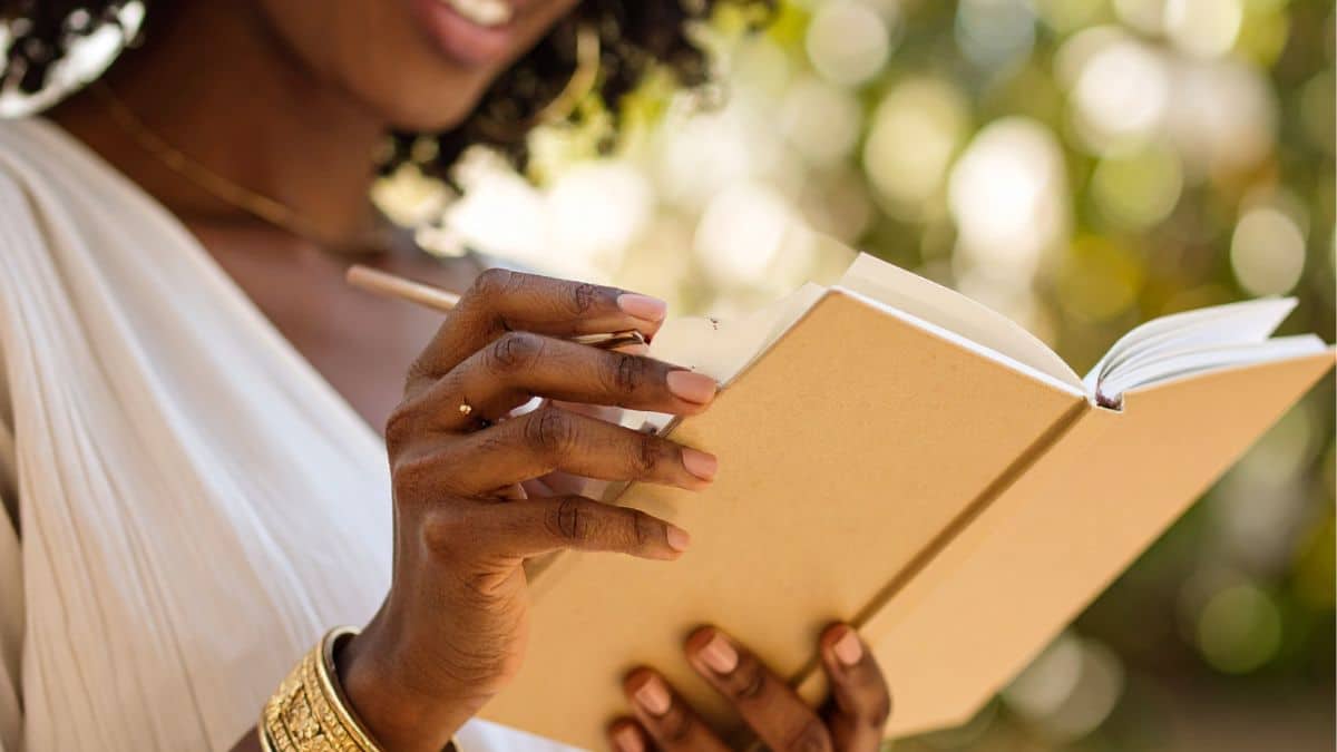 woman journaling outside in the calm environment