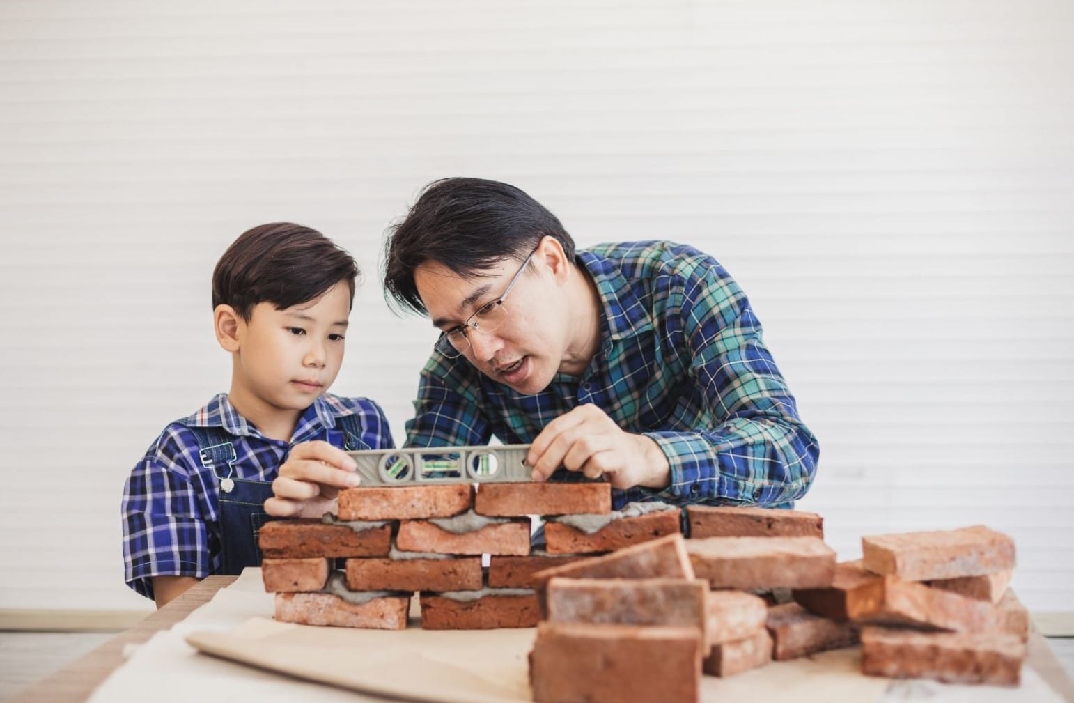 Father and son doing building project together